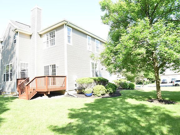 beautifully landscaped end unit townhouse back view