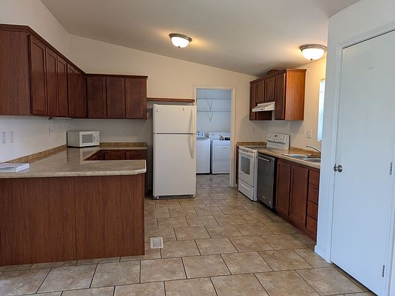 Alder wood kitchen cabinets, Refrigrator, dishwasher included.