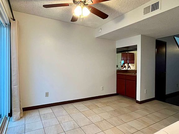 Dining area, alternate angle showing wet bar on left side