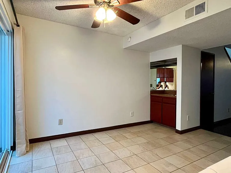 Dining area, alternate angle showing wet bar on left side