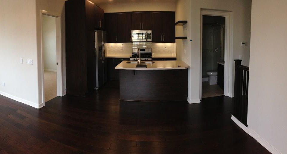 Quartz Counters and Stainless Steel Appliances. White tile