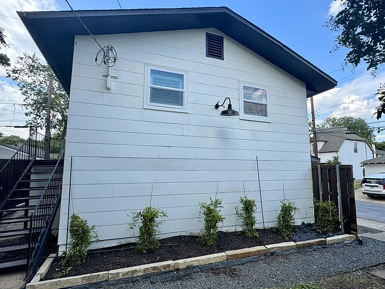 Backyard mother-in-law unit, which is built above the detached garage, and where a 3rd tenant resides.