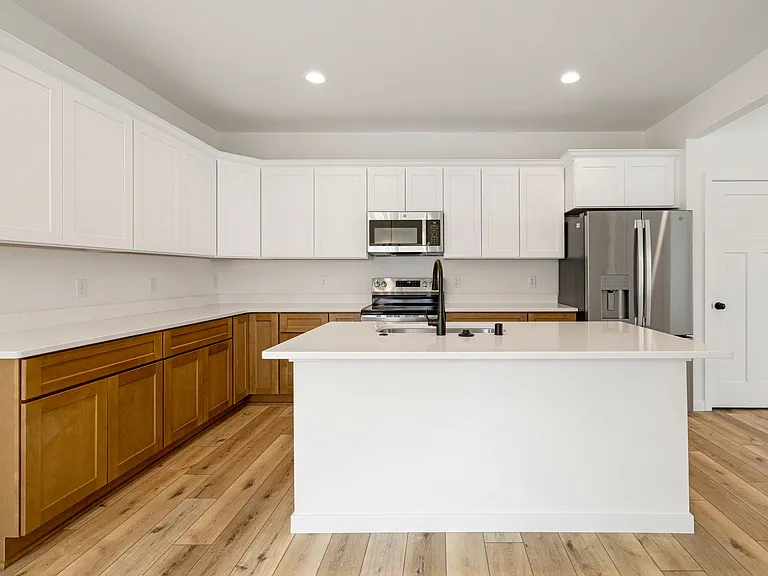 Functional Style - Large Island, Breakfast Bar Seating, Abundant Cabinet Space & Stainless Steel Appliances!