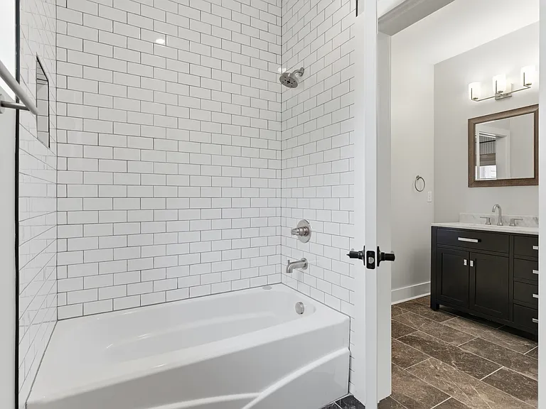 Jack & Jill bathtub and shower combo.