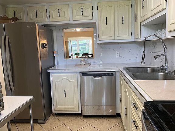 Kitchen with dining  portal.
