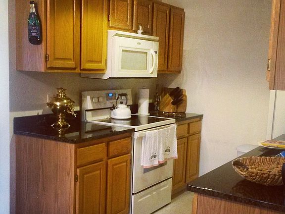 Open kitchen, clean and spacey with granite counter tops