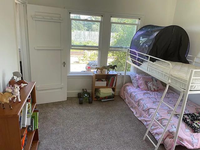 Primary Bedroom (would fit king size bed). Custom blackout shades installed, though not pictured here.