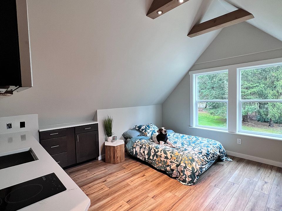 Under bed pull-out storage on both sides. Storage also inside bedside table and cabinets.