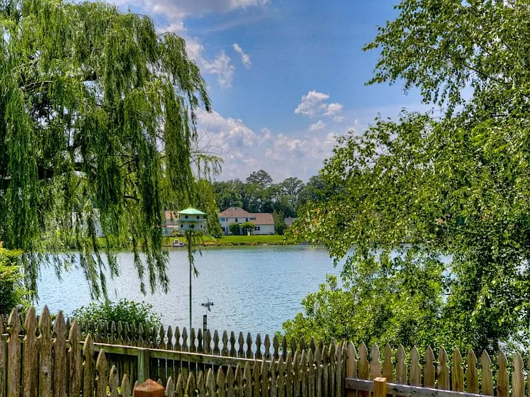 life is good on the lake, fenced in yard with dock