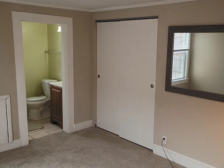bedroom with private full bathroom