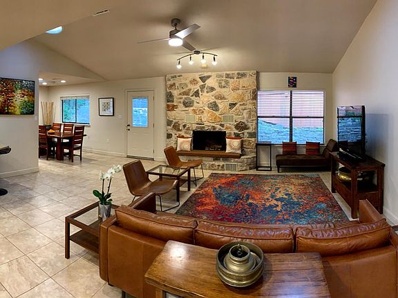 panoramic living room view with the glimpse of dining and the kitchen