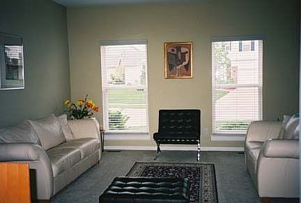 Formal living room greets guests.