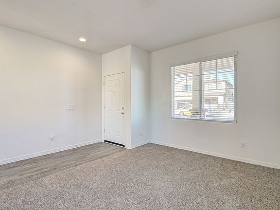 Den near the entry hall, perfect for a home office.