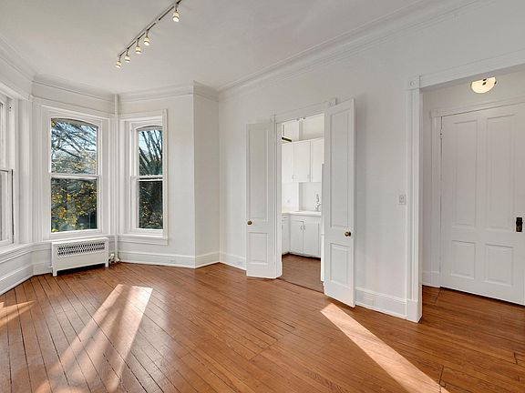 Spacious dining room when you enter with a view of Q street in the bay windows (ideal space for a small table and comfortable seats). To the immediate right, a coat closet, then the kitchen.