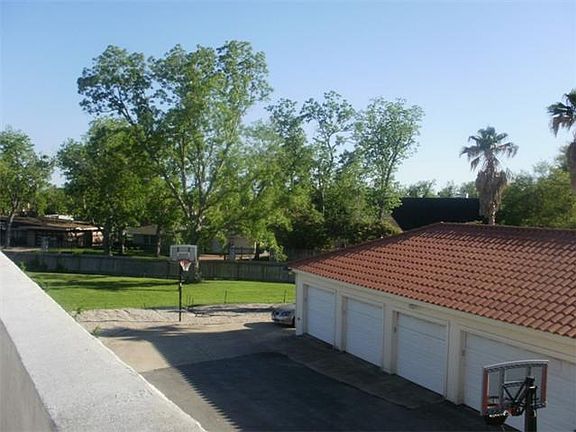 Another view of detached 5 car garage and plenty of room to park cars in driveway from side entrance
