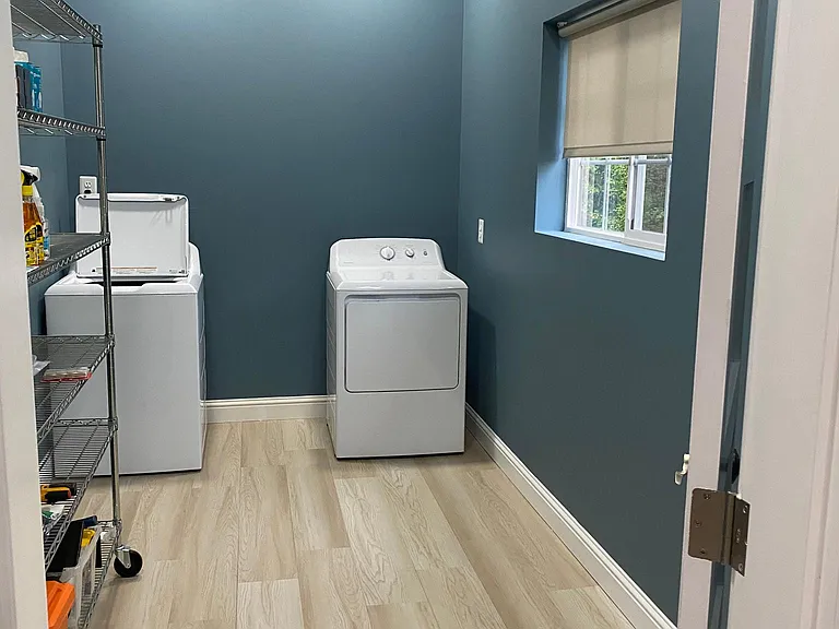 Large pantry off kitchen with lots of storage and brand new washer and dryer.
