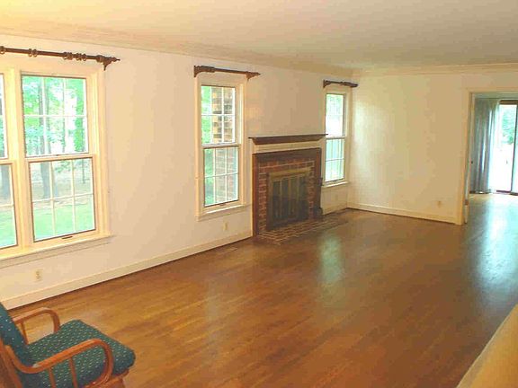 Living room opens to sunroom