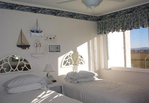 twin bedroom with view of bird estuary, hear the clapper rai