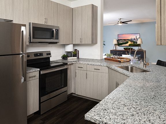 Beautifully remodeled kitchens feature stainless steel appliances