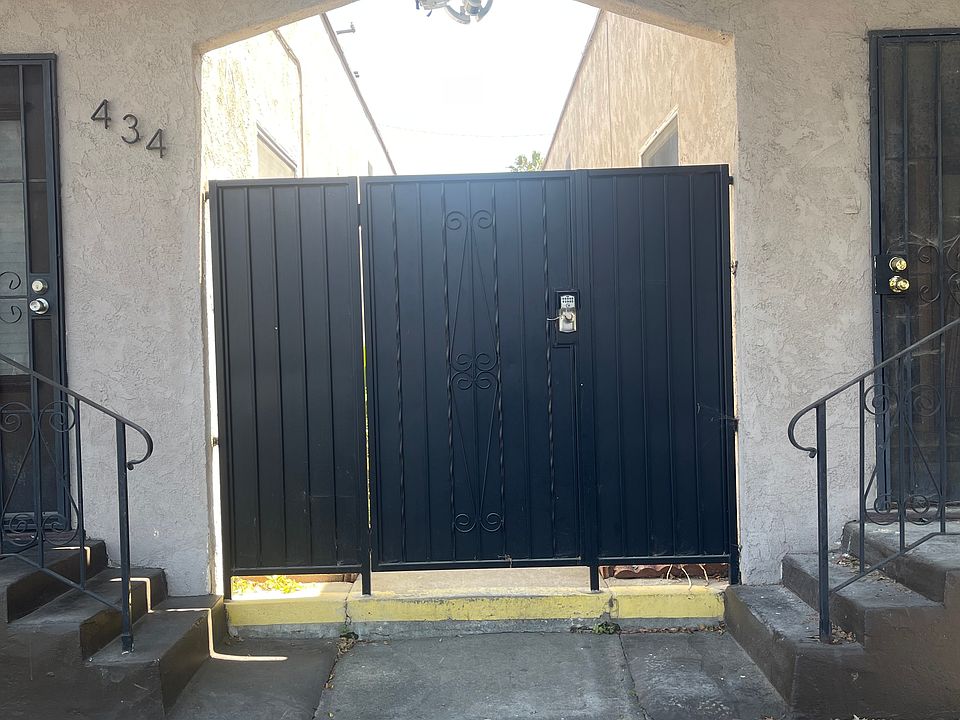 Front of Building with full security gate and security camera