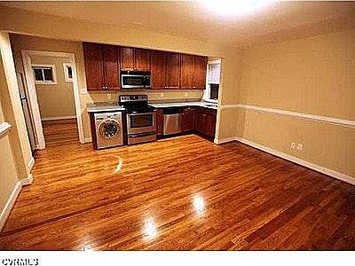 great room wood floor view to kitchen