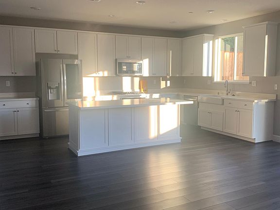 This bright and gorgeous kitchen has it all_tons of storage, a walk-in pantry, and a butler's pantry for effortless entertaining. Just add bar stools to the island and celebrate the holidays the right way!