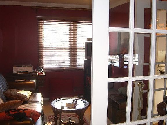 den w/double french doors from dining room & french door access from kitchen