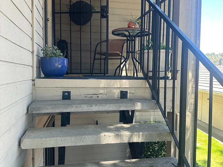 stairs to 2nd floor condo front door