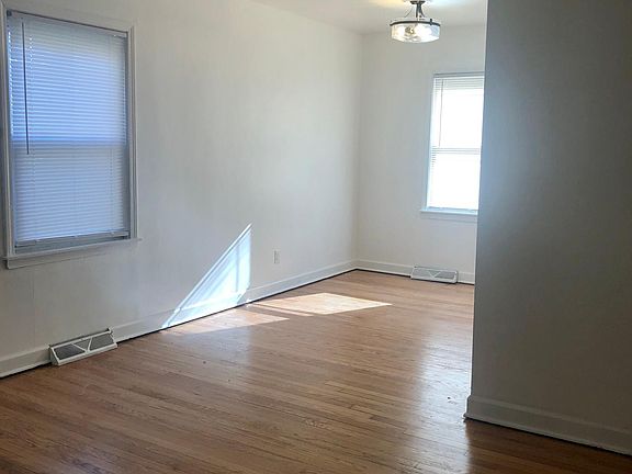 Dining Room--New blinds and lights. Ready for a family dinner
