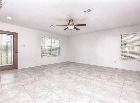Super clean tile throughout the downstairs, big windows, classy new front door with a secure storm d