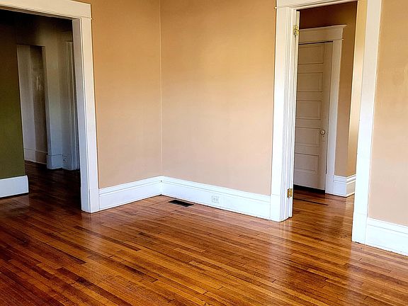 Living Room with Bedroom #1 and leading to Kitchen