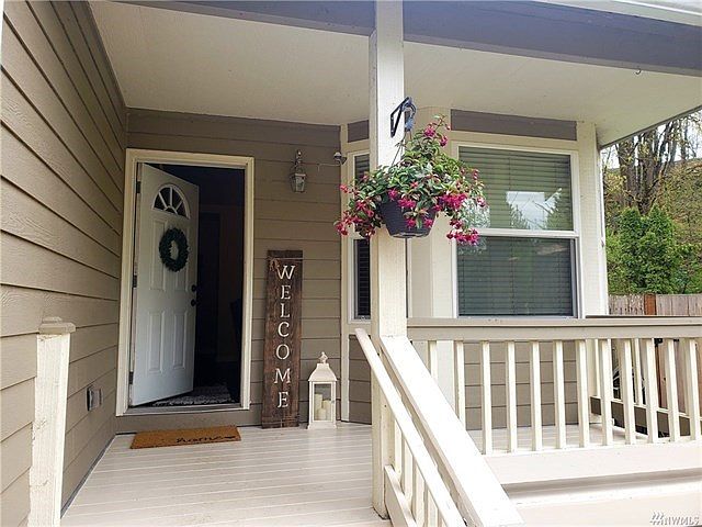 Small front porch welcomes you to this darling home