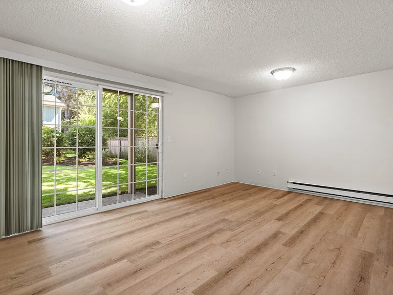 Living space with natural light and outdoor access. Living space with natural light and outdoor access.