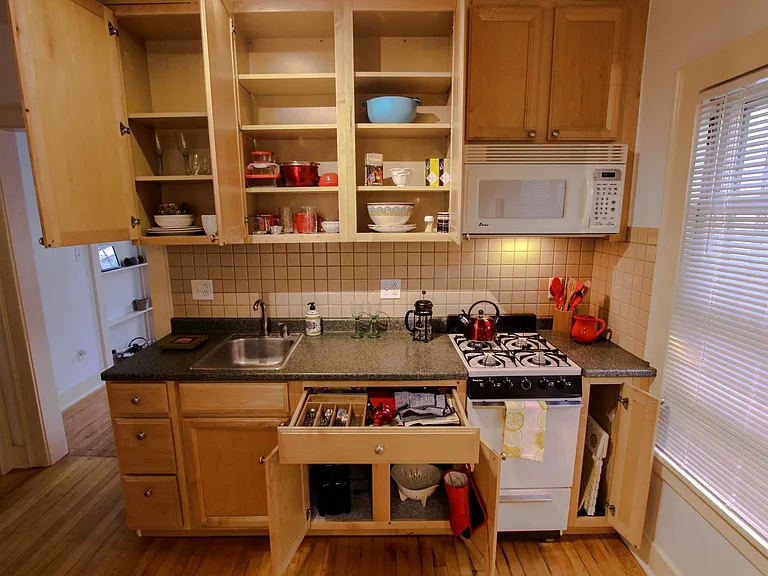 Fully stocked kitchen with gas stove and microwave. Breakfast nook.