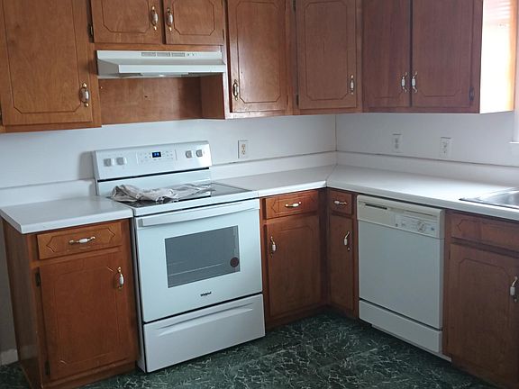 Kitchen with new stove and faucet