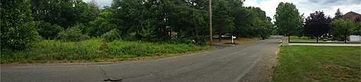 Panorama of street.  Subject property is on the left side