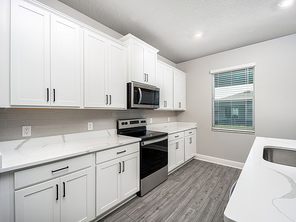 The kitchen comes with a full suite of stainless steel appliances!