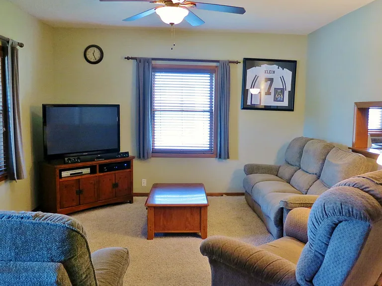 Living room with pass-thru into the kitchen (Note--carpet has been replaced with laminate flooring)