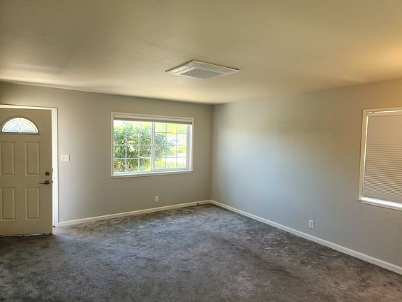 Large sunny living room with New energy efficient Split System A/C Heat by Samsung that is Independently controlled for each room to save