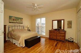 One of two bedrooms with beautiful hardwood flooring.