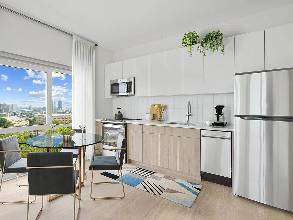 Elevate your lifestyle at 345 Baldwin with this sleek, modern kitchen featuring stainless steel appliances and inviting natural light. Ideal for culinary enthusiasts, it perfectly blends style and functionality. Schedule your tour today!