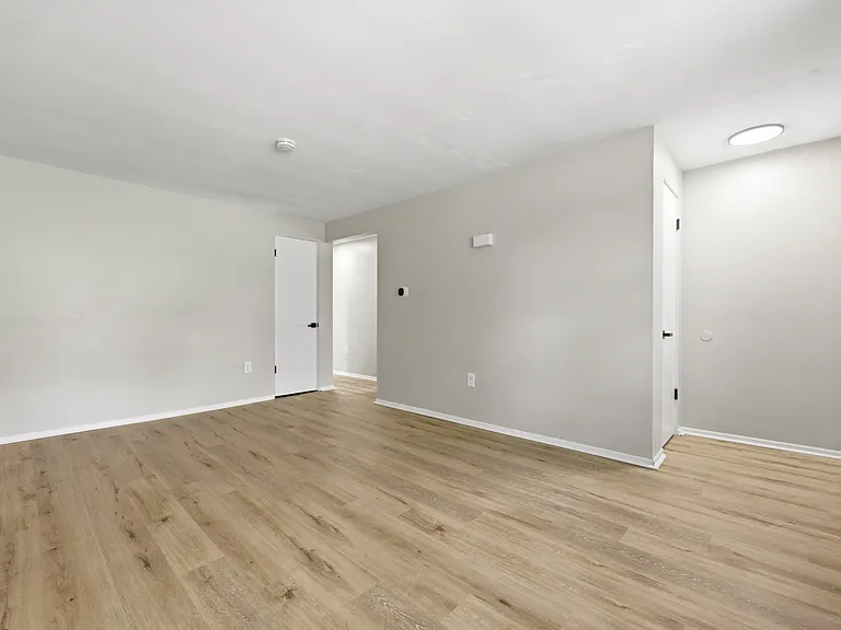 Living room. Coat closet at the entry, and another storage closet near the back of the room.