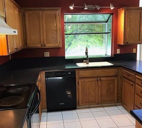The kitchen window looks out to the pool and patio...
