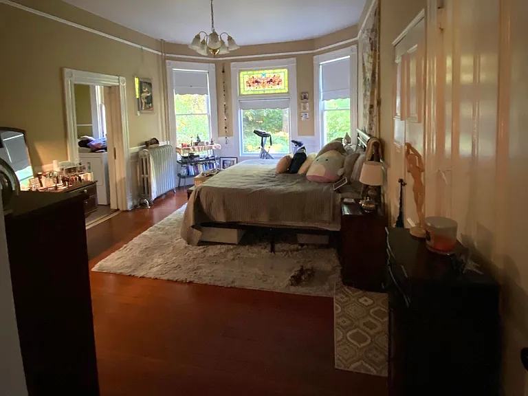 Good sized bedroom with King bed & stained glass