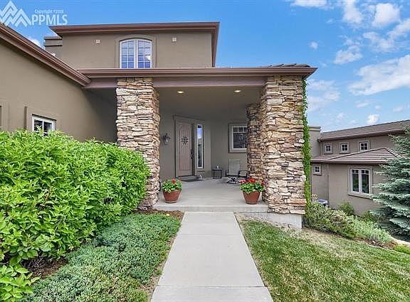 The large covered front porch is a great spot to take in the mountain views!