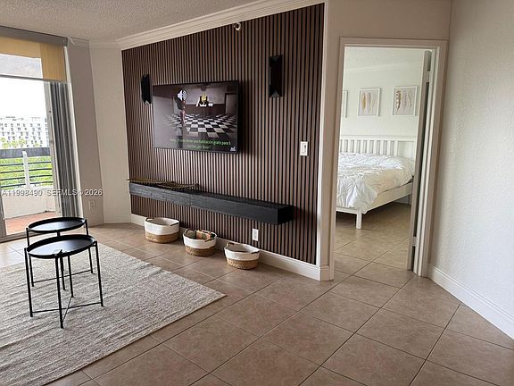 3rd image of 3600 Mystic Pointe Dr APT 910