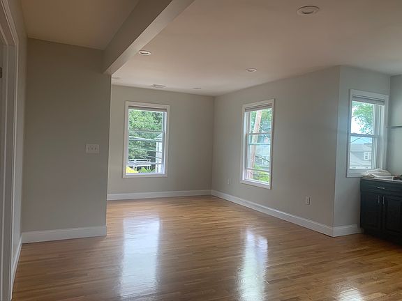 Large open living and dining area with natural light