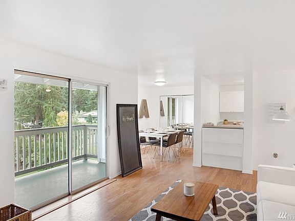 Living room leads into the dining and kitchen areas. 