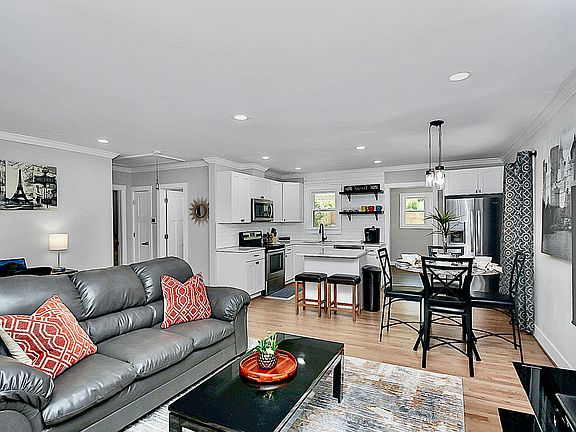 Open concept. Living room opening up to the kitchen and dining space.