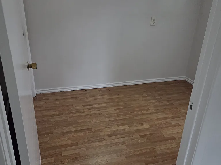 Bonus room that can be used as an office space or for storage. View from kitchen.